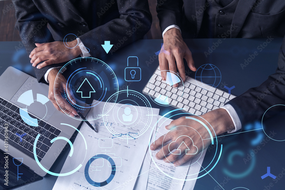 ESg due diligence done by Two research and development specialists man and woman working on project to create a new approach to develop software to improve business. Technological icons over the table with document.