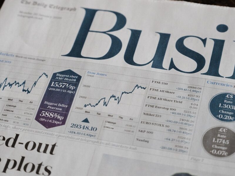 Financial services section in a newspaper with a picture of a man on it